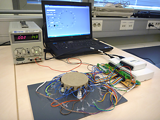 A prototype version including 8 independently controllable heating elements and 16 temperature measuring thermistors. 