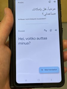 Picture of a smartphone that has a translation app open.