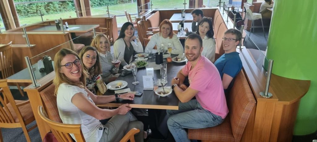 Picture of Faezeh having dinner with people from her course