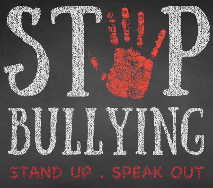 A poster that says "Stop bullying. Stand up. Speak out."