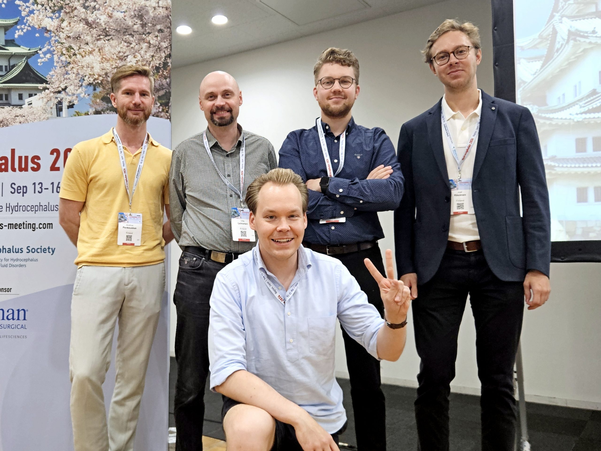 Andrius Penkauskas and colleagues attending a conference